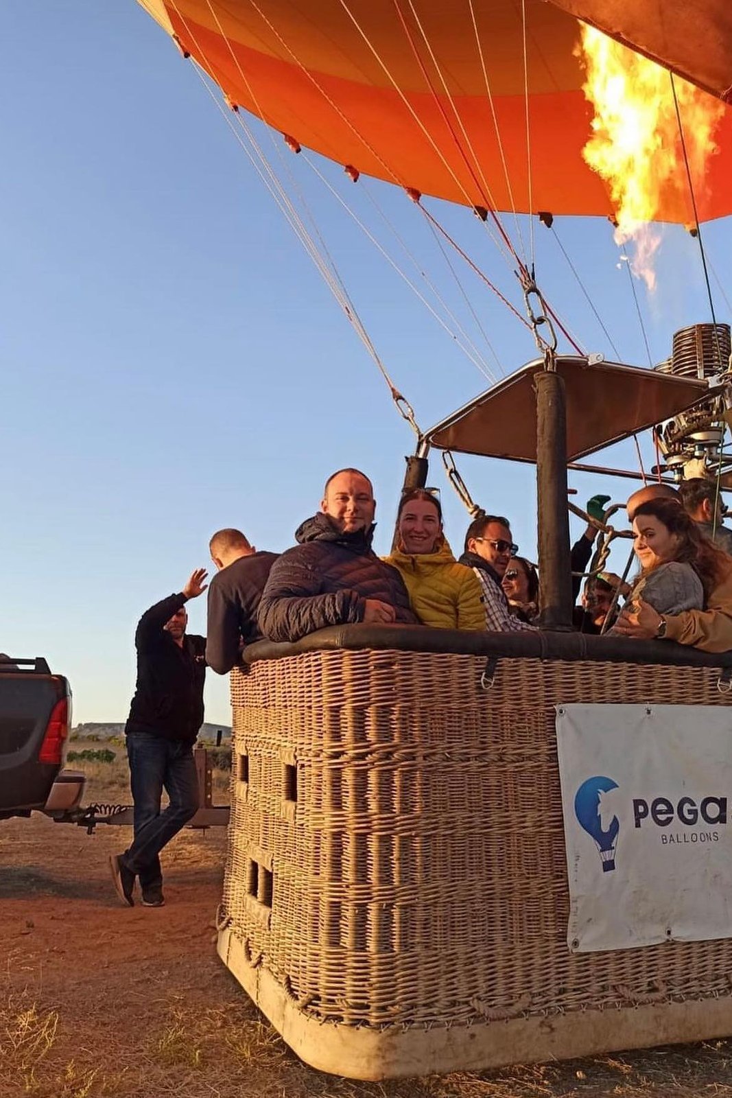 Guests in a hot air balloon basket before take-off at sunrise in Cappadocia